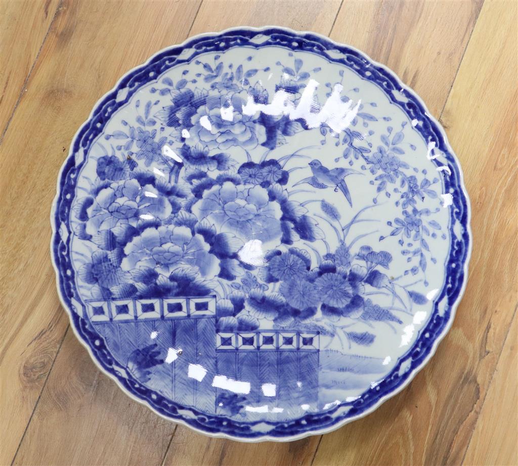 A Japanese blue and white charger decorated with a flying bird and chrysanthemum flowers, 48cm diameter Dia 47.5cm